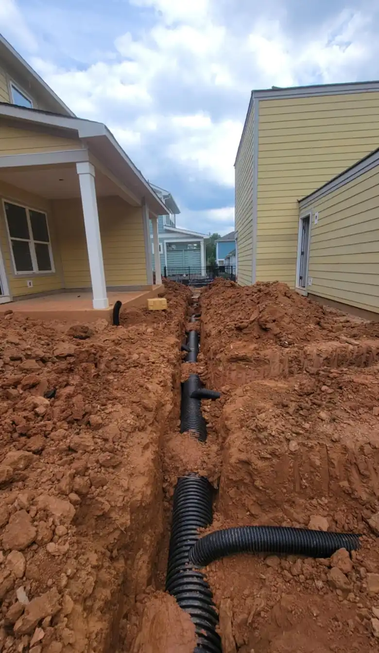 Underground trenching for irrigation lines between homes in Charlotte, NC