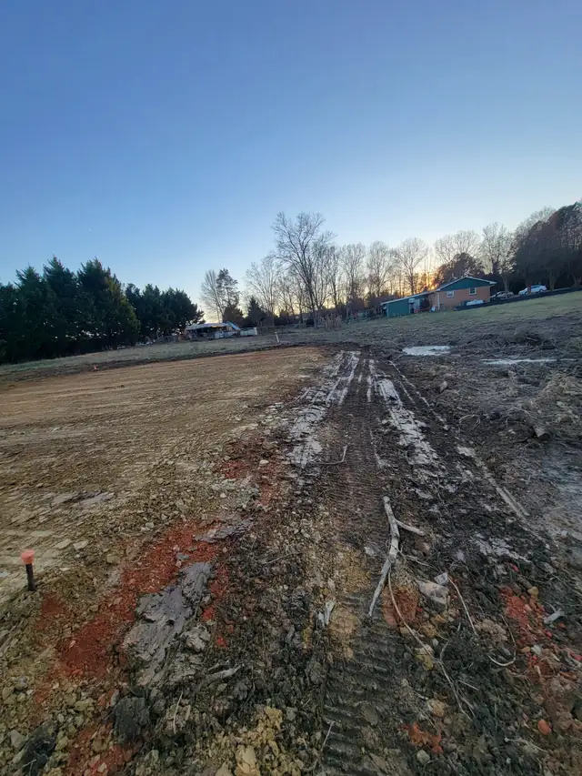 Erosion-control blanket over graded soil, ready for grass, Charlotte NC